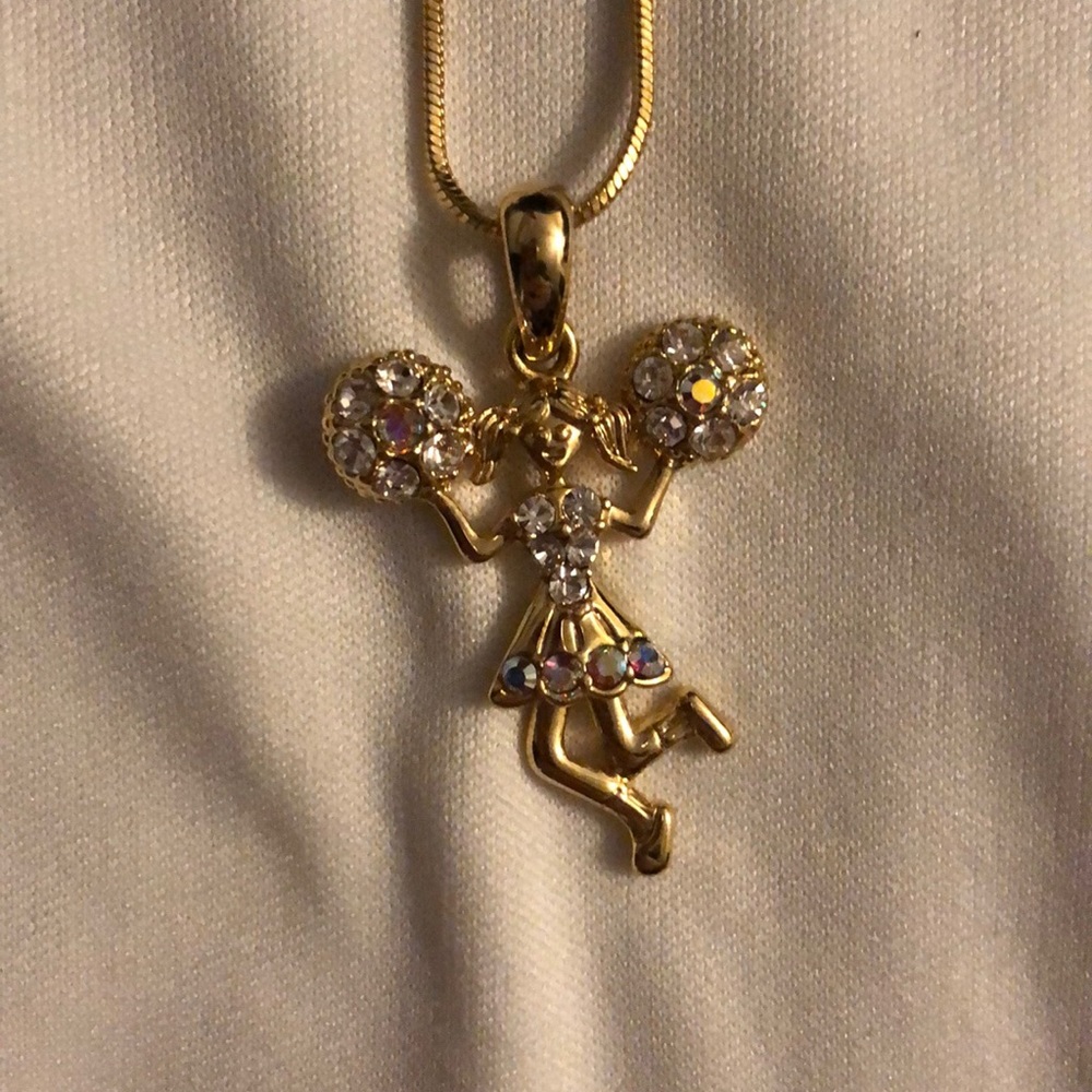 A gold colored cheer necklace